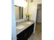 Bathroom featuring double sinks, granite countertop, and tile flooring at 6242 E Hearn Rd, Scottsdale, AZ 85254