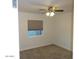 Bright bedroom featuring a window and neutral carpet flooring at 6242 E Hearn Rd, Scottsdale, AZ 85254
