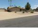 Exterior of the home features a well-maintained landscape and ample parking at 6242 E Hearn Rd, Scottsdale, AZ 85254