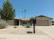 Inviting single-story home featuring desert landscaping, a two-car garage, and a tidy facade at 6242 E Hearn Rd, Scottsdale, AZ 85254