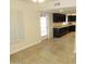 Bright kitchen featuring granite countertops, dark cabinets, and access to the backyard at 6242 E Hearn Rd, Scottsdale, AZ 85254