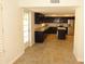 Inviting kitchen with granite countertops, dark wood cabinets, and stainless appliances at 6242 E Hearn Rd, Scottsdale, AZ 85254