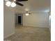 Spacious living room with tile flooring and natural light from shuttered windows at 6242 E Hearn Rd, Scottsdale, AZ 85254