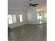 Bright, open living room with tile floors, shutters, and a modern ceiling fan, perfect for entertaining at 6242 E Hearn Rd, Scottsdale, AZ 85254