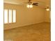 Spacious room featuring tile flooring, neutral paint, and bright natural light at 6242 E Hearn Rd, Scottsdale, AZ 85254