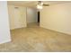 Large room with tile flooring, neutral paint, and a view into other rooms at 6242 E Hearn Rd, Scottsdale, AZ 85254
