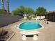 Backyard pool features a seating area and mature trees, perfect for outdoor entertaining at 6242 E Hearn Rd, Scottsdale, AZ 85254
