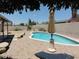 A shaded backyard pool provides a refreshing escape from the sun at 6242 E Hearn Rd, Scottsdale, AZ 85254