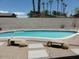 Sparkling backyard pool surrounded by lush landscaping at 6242 E Hearn Rd, Scottsdale, AZ 85254