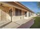 Enclosed patio area with backyard access featuring desert landscaping and hardscape at 6439 W Adobe Dr, Glendale, AZ 85308