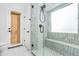 Contemporary bathroom featuring a glass-enclosed shower with a tiled bench and modern fixtures at 6439 W Adobe Dr, Glendale, AZ 85308