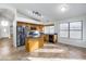 Bright kitchen featuring oak cabinets, stainless steel appliances, island, breakfast bar, and ceramic tile floors at 6439 W Adobe Dr, Glendale, AZ 85308