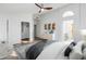 Staged main bedroom showcasing a modern aesthetic with decor and furnishings at 6439 W Adobe Dr, Glendale, AZ 85308