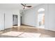 Spacious main bedroom with wood-look floors, ensuite bathroom, and a walk-in closet at 6439 W Adobe Dr, Glendale, AZ 85308