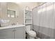 Cozy bathroom featuring a sink, toilet and shower perfect for guests at 6785 W Tether Trl, Peoria, AZ 85383