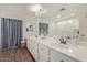 Bright bathroom with double sinks, ample counter space, and elegant fixtures for a spa-like experience at 6785 W Tether Trl, Peoria, AZ 85383