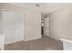 Neutral bedroom with closet, carpet, and door to another room at 6785 W Tether Trl, Peoria, AZ 85383