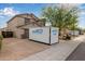 Two-story home with a spacious driveway and a two-car garage, complemented by desert landscaping at 6785 W Tether Trl, Peoria, AZ 85383
