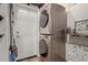 Modern laundry area with stacked washer and dryer units at 6785 W Tether Trl, Peoria, AZ 85383