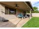The covered patio offers ceiling fans, outdoor furniture, a bbq and is perfect for relaxing or entertaining guests at 6785 W Tether Trl, Peoria, AZ 85383