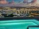 Rooftop pool with vibrant water and city lights for a luxurious, relaxing experience at 7120 E Kierland Blvd # 709, Scottsdale, AZ 85254