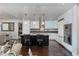 Modern kitchen featuring white cabinets, stainless steel appliances, a large island, and bar stool seating at 7181 E Camelback Rd # 208, Scottsdale, AZ 85251