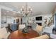 Elegant kitchen and living room combo, complete with hardwood floors and a decorative chandelier at 7181 E Camelback Rd # 208, Scottsdale, AZ 85251
