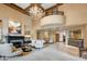 Beautiful lobby area featuring high ceilings, elegant furnishings, a fireplace and luxurious finishes at 7181 E Camelback Rd # 208, Scottsdale, AZ 85251