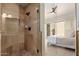 Walk-in shower with neutral-toned tile, glass door, and modern fixtures at 7955 E Chaparral Rd # 120, Scottsdale, AZ 85250