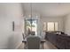 Dining area with stylish chandelier and views of the outside at 7955 E Chaparral Rd # 120, Scottsdale, AZ 85250