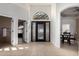 Welcoming entryway with decorative iron door, archways, and tile flooring at 7955 E Chaparral Rd # 120, Scottsdale, AZ 85250