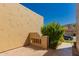 Desert home exterior featuring a private courtyard with lush greenery and stucco walls at 7955 E Chaparral Rd # 120, Scottsdale, AZ 85250