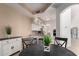 Cozy eat-in kitchen features white cabinetry, stainless appliances and convenient breakfast bar seating at 7955 E Chaparral Rd # 120, Scottsdale, AZ 85250