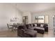 Bright living room featuring neutral colors, large sectional sofa, and dining area at 7955 E Chaparral Rd # 120, Scottsdale, AZ 85250