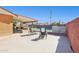 A spacious backyard with a covered patio, outdoor seating, and a sparkling fenced pool offers great outdoor living at 8107 E Mitchell Dr, Scottsdale, AZ 85251