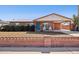 Charming single-story brick home featuring a covered porch and carport, showcasing Southwestern architecture at 8107 E Mitchell Dr, Scottsdale, AZ 85251