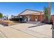 Charming single-story brick home featuring a covered porch and carport, surrounded by desert landscaping at 8107 E Mitchell Dr, Scottsdale, AZ 85251