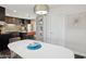 Bright eat-in kitchen boasts updated cabinets, a large island, stainless appliances, and modern lighting at 8107 E Mitchell Dr, Scottsdale, AZ 85251