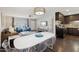 Open floorplan living room featuring stylish furniture, ceiling fan, and seamless flow into dining area at 8107 E Mitchell Dr, Scottsdale, AZ 85251
