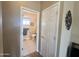 Comfortable half-bathroom with tiled floors and a traditional toilet located off of a main hallway at 903 S Mineshaft Dr, Apache Junction, AZ 85119
