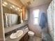 Bathroom with sink, mirror, and toilet at 903 S Mineshaft Dr, Apache Junction, AZ 85119