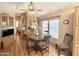 Inviting dining area with wood floors, built-in cabinets, and seating for four at 903 S Mineshaft Dr, Apache Junction, AZ 85119
