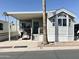 Attractive property featuring a covered parking area and a quaint, well-maintained front yard at 903 S Mineshaft Dr, Apache Junction, AZ 85119