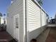 Home exterior showcasing access door and siding at 903 S Mineshaft Dr, Apache Junction, AZ 85119