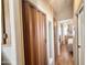 Hallway with closet and bedroom view featuring laminate floors, neutral walls and built in storage at 903 S Mineshaft Dr, Apache Junction, AZ 85119