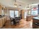 Well-lit kitchen with three ceiling fans, breakfast nook, stainless sink and bright, natural wood at 903 S Mineshaft Dr, Apache Junction, AZ 85119