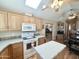 Bright kitchen with an island, modern appliances, and a view to the dining area at 903 S Mineshaft Dr, Apache Junction, AZ 85119