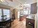 Well-lit kitchen with three ceiling fans, breakfast nook, stainless sink and bright, natural wood features at 903 S Mineshaft Dr, Apache Junction, AZ 85119