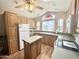 Well-lit kitchen with wood cabinets, stainless steel appliances, and an island at 903 S Mineshaft Dr, Apache Junction, AZ 85119