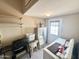 Functional laundry room with washer, dryer, grill, shelves and ample space at 903 S Mineshaft Dr, Apache Junction, AZ 85119